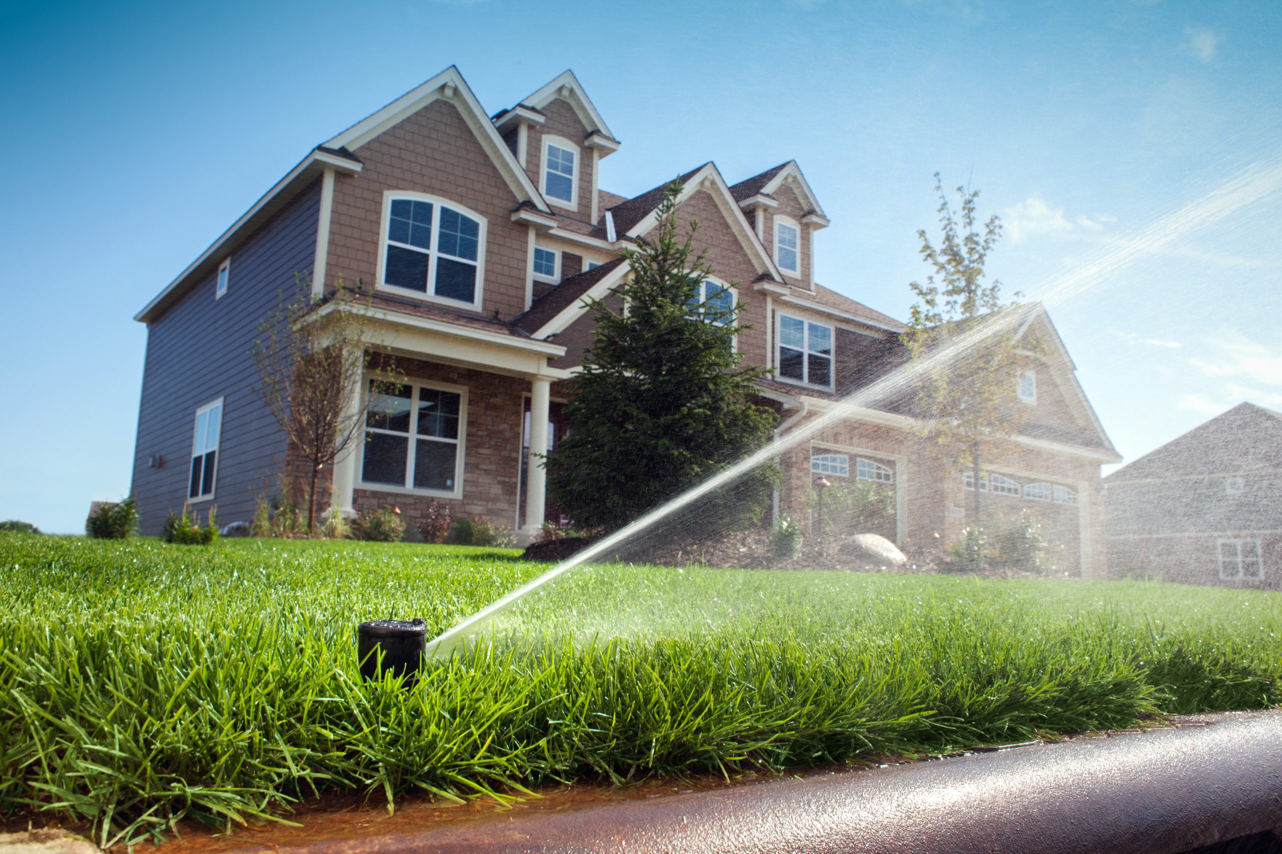 Image of a sprinkler with water coming out